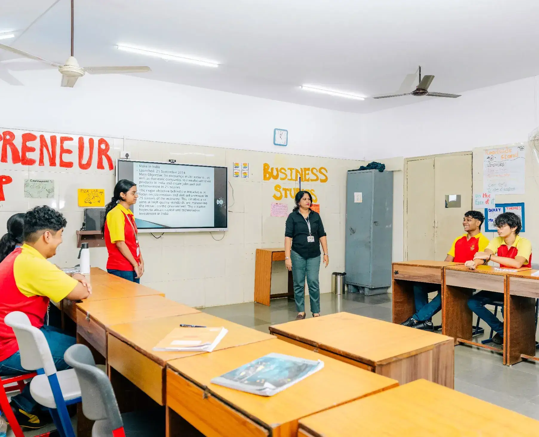 A classroom with a teacher and students